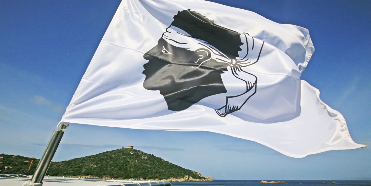 Corsican flag depicting a moor's head blowing in the wind