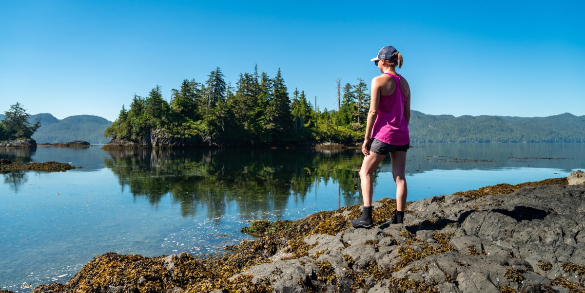 Women hiking along the water on Vancouver Island