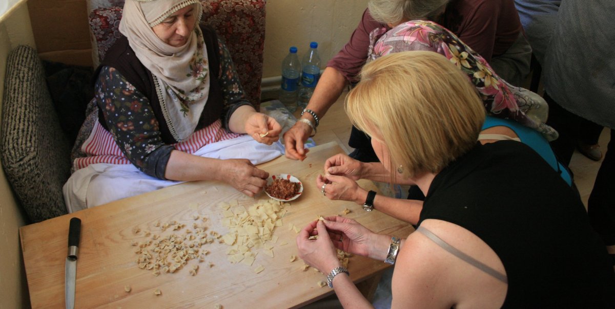 Guests making manti in Turkey with locals