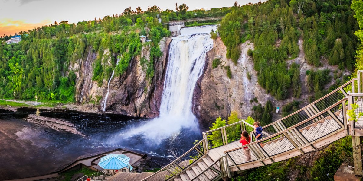 Tourists on a boardwalk overlooking Montmorency Falls in Quebec, Canada