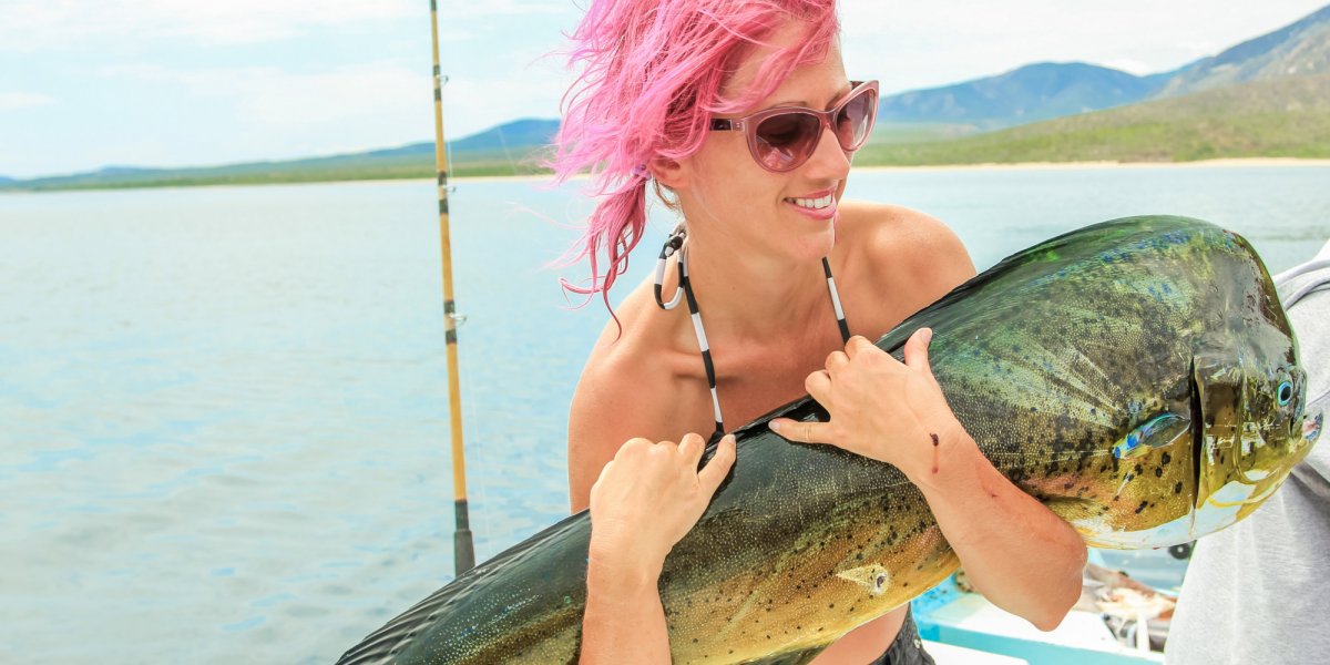 Woman holding a huge fish in Loreto Baja
