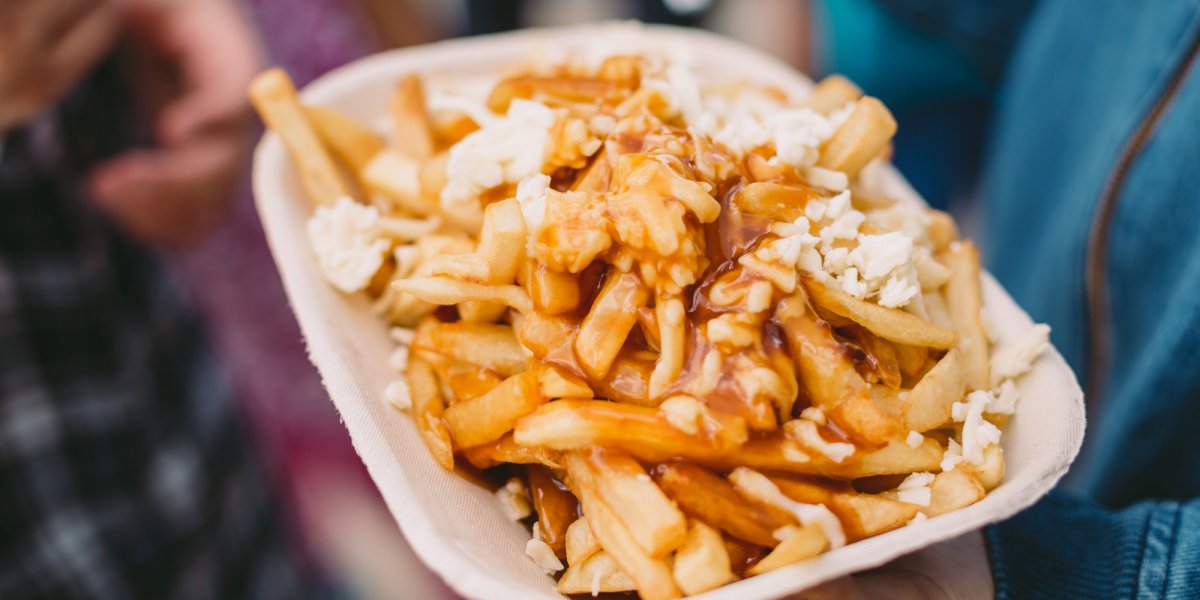 Traditional poutine made up of french fries covered in gravy and cheese curds in Quebec