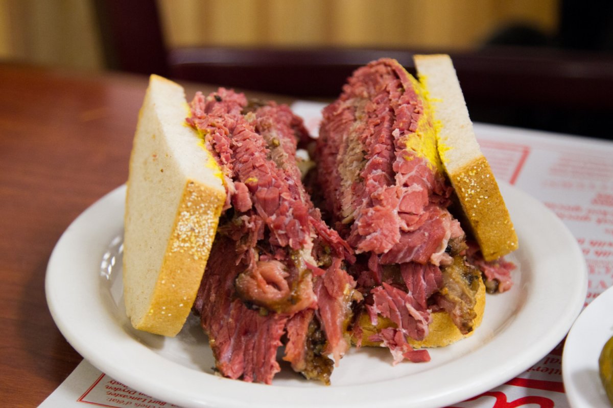 smoked meat sandwich on white plate