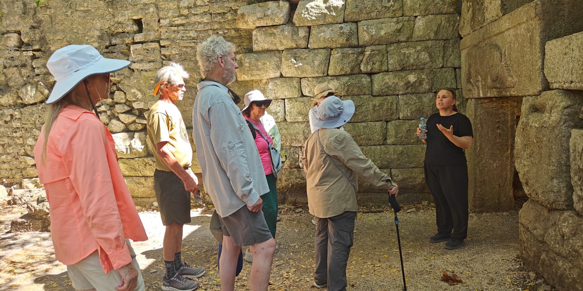 Local guide welcomes guests before a day of sea kayaking along the Croatian coastline during a guided multi country adventure.