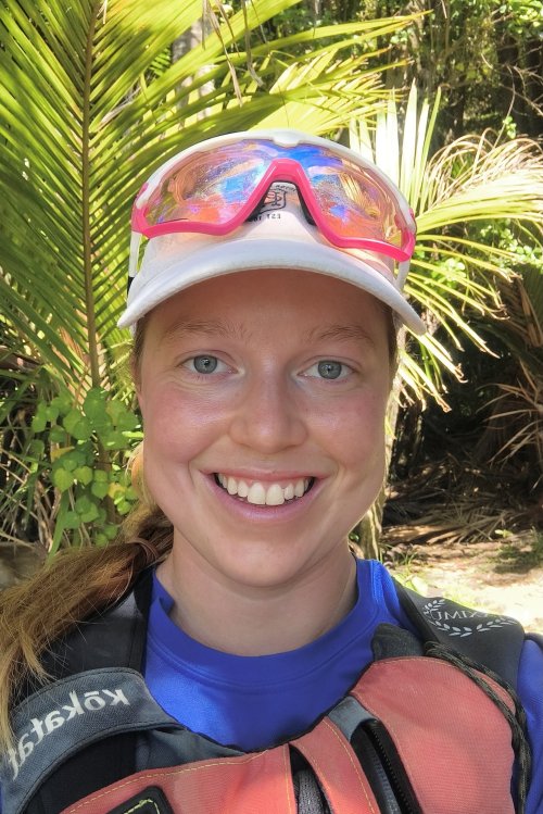 A headshot of a sea kayak adventures guide smiling at the camera.