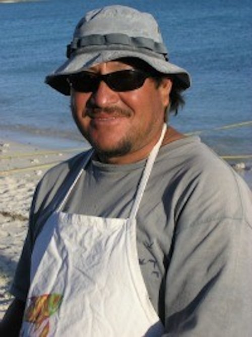 Sea kayaking guide, Ramon, smiling while on a beach in Baja Mexico. 