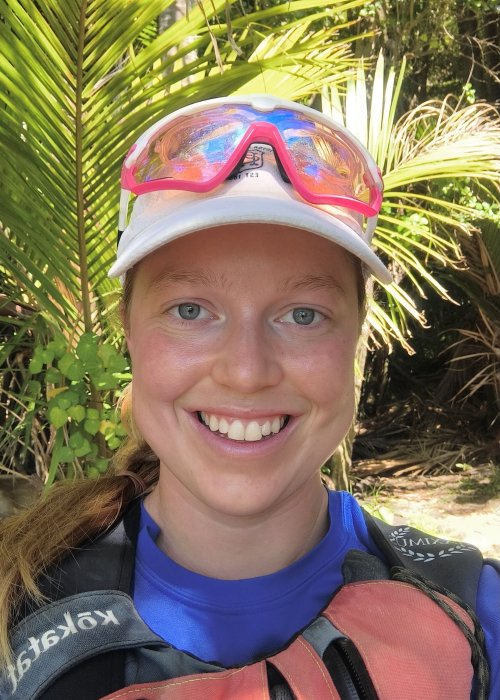 A headshot of a sea kayak adventures guide smiling at the camera.