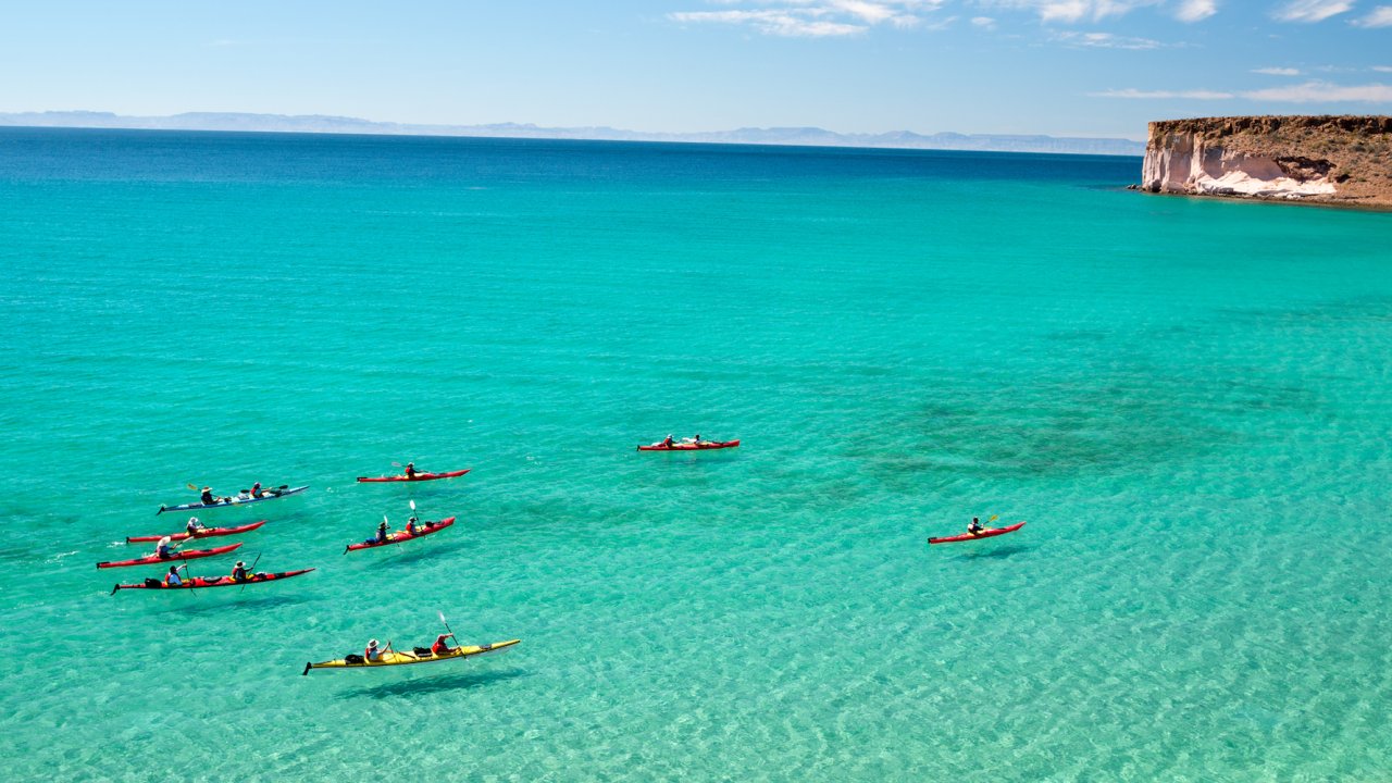 People sea kayaking in the Sea of Cortez outside of La Paz