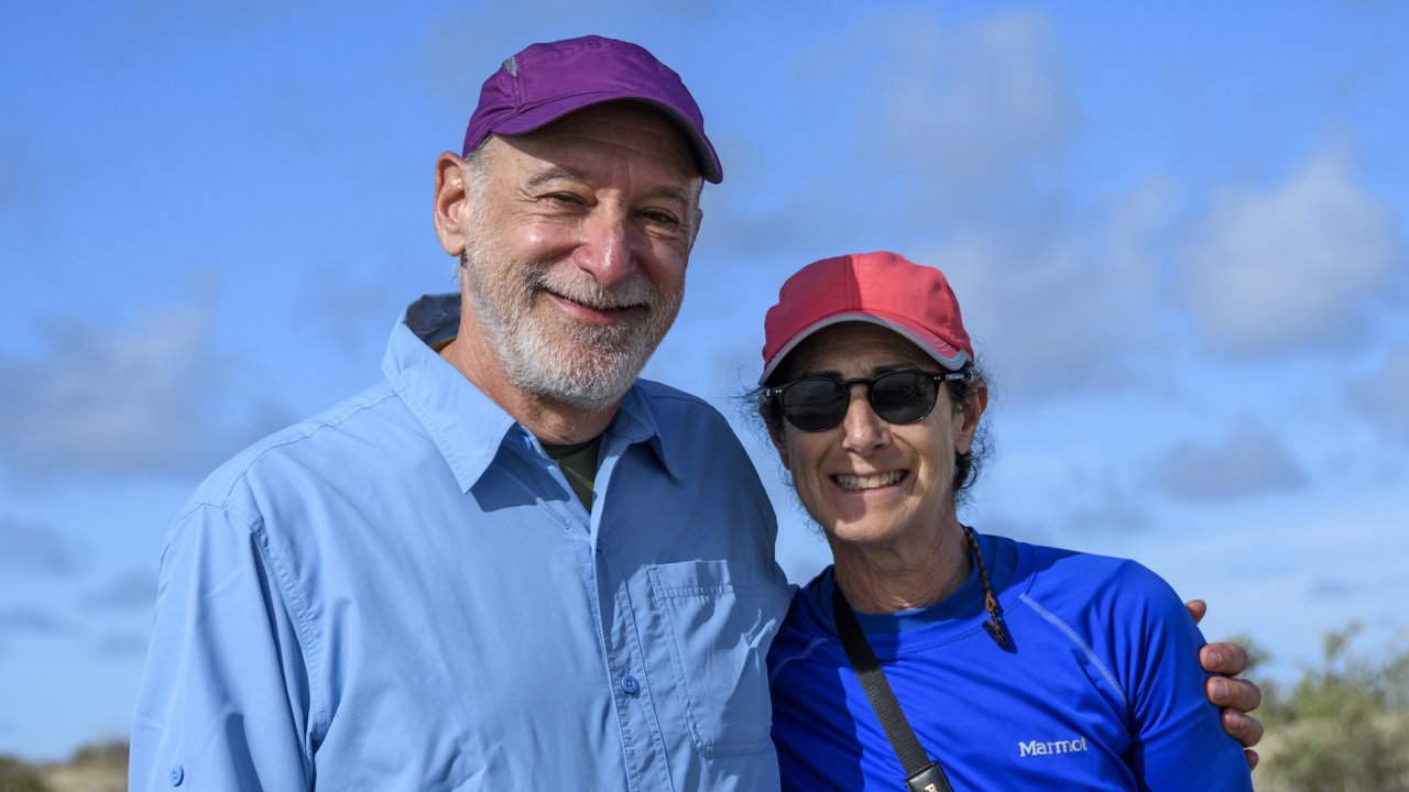 A couple smiling for a photo while on a whale watching tour near La Paz, Baja California Sur
