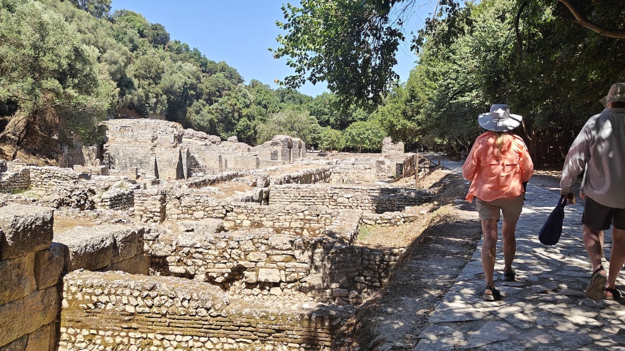 Two people walking though a historic site in Montenegro Europe