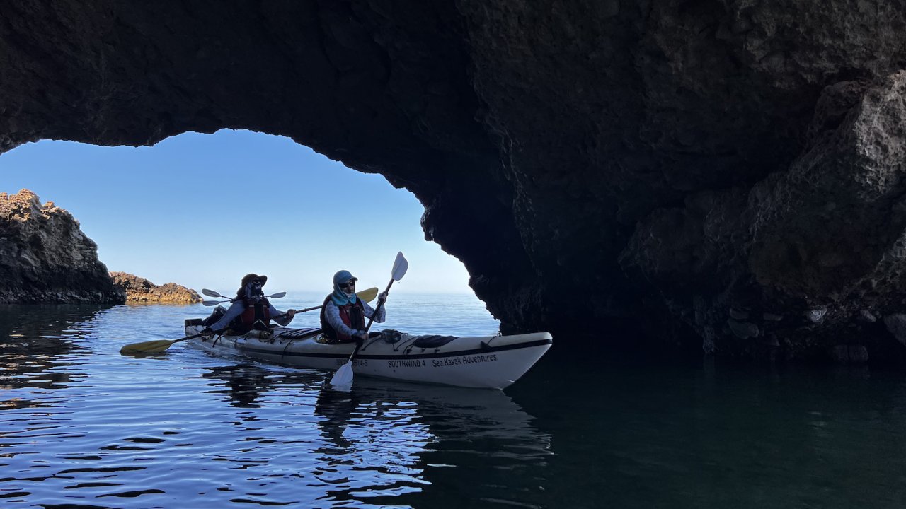 sea kayaking through a scenic cove in the Sea of Cortez off the coast of La Paz