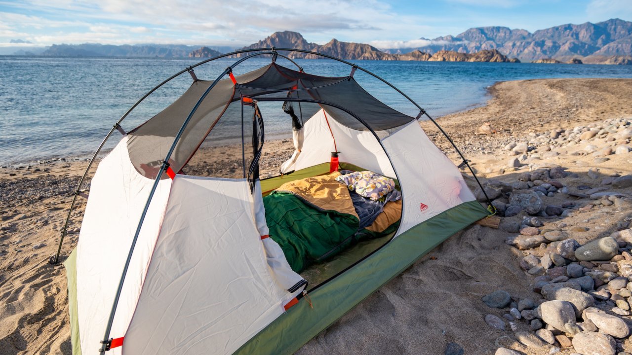View inside of a single tent set up in the sand on a beach on a remote island in Loreto Bay