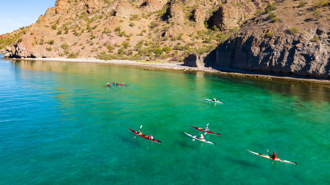People sea kayaking in the Sea of Cortez in the sun