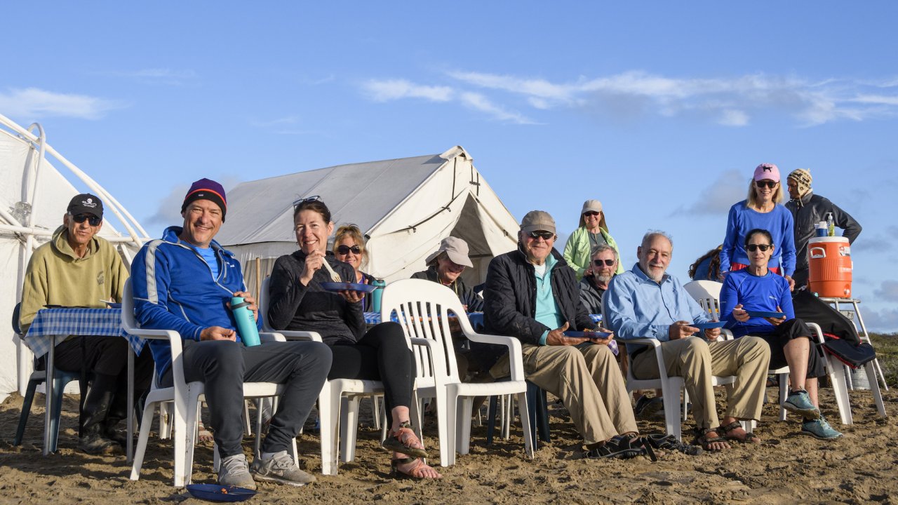 A group of whale watchers sitting on the beach in Baja California Sur