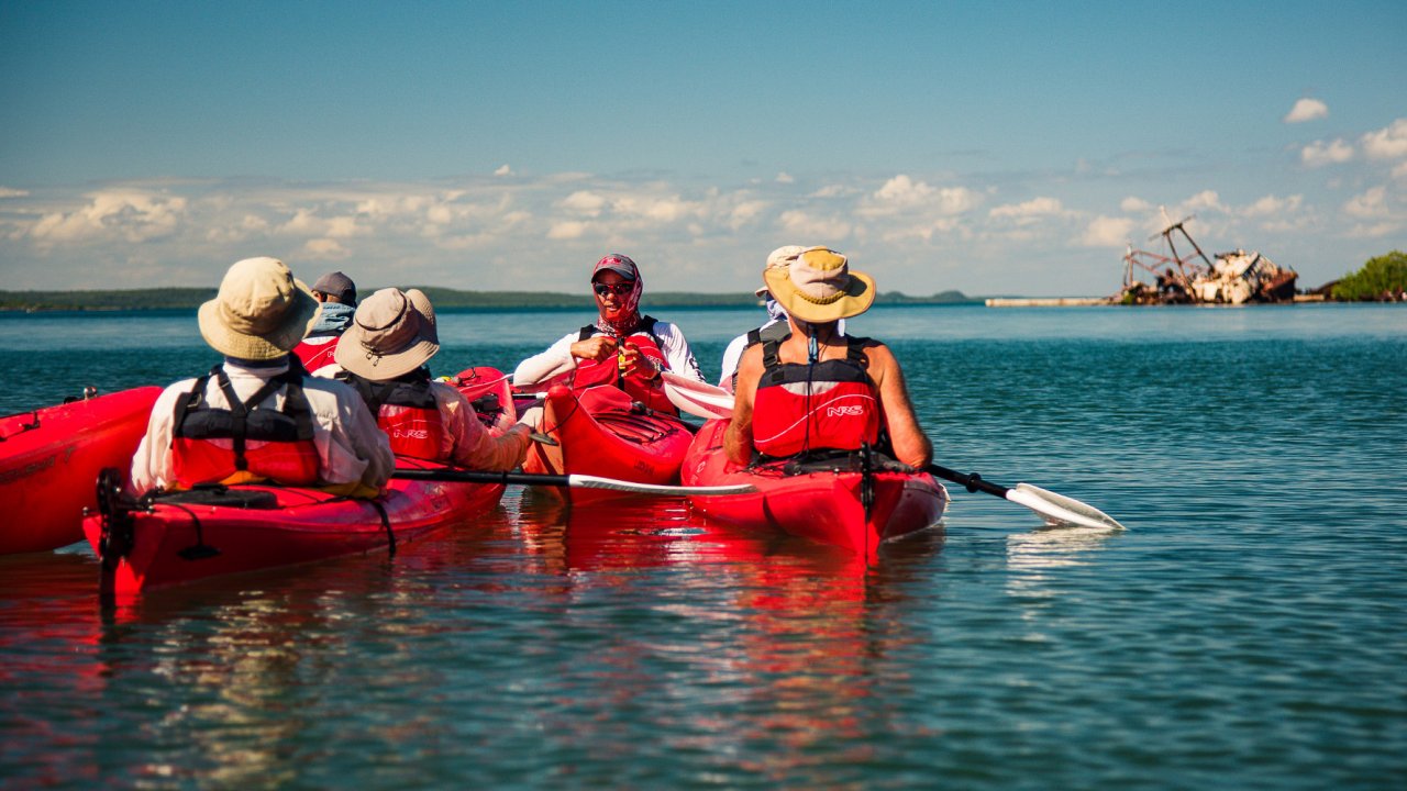 group of kayakers in water in cuba