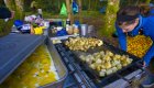 Eggs and potatoes cooking on a griddle while camping in lush British Columbia
