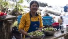 Sea Kayak Adventures guide prepares fresh salad at a rustic camp kitchen in British Columbia.
