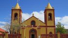 red and yellow church in historic baja town