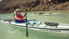 Person paddling a white kayak in the Gulf of California on a sunny day