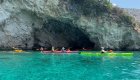 A group of sea kayakers paddling the turquoise waters of the Adriatic Sea