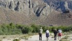 group of people walking down remote road in Baja