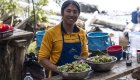 Guide preparing fresh salad at a wilderness kayak camp during a British Columbia orca kayaking tour