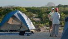 lady and tent in the galapagos
