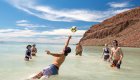 Playing volleyball in Sea of Cortez while camping on the beach