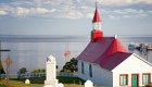 white and red church in tadoussac