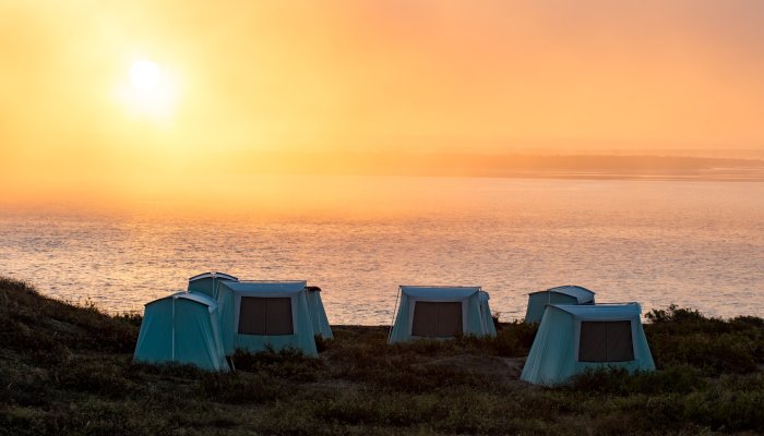 Canvas style tents on sand dunes along the Pacific Ocean in Baja California Sur